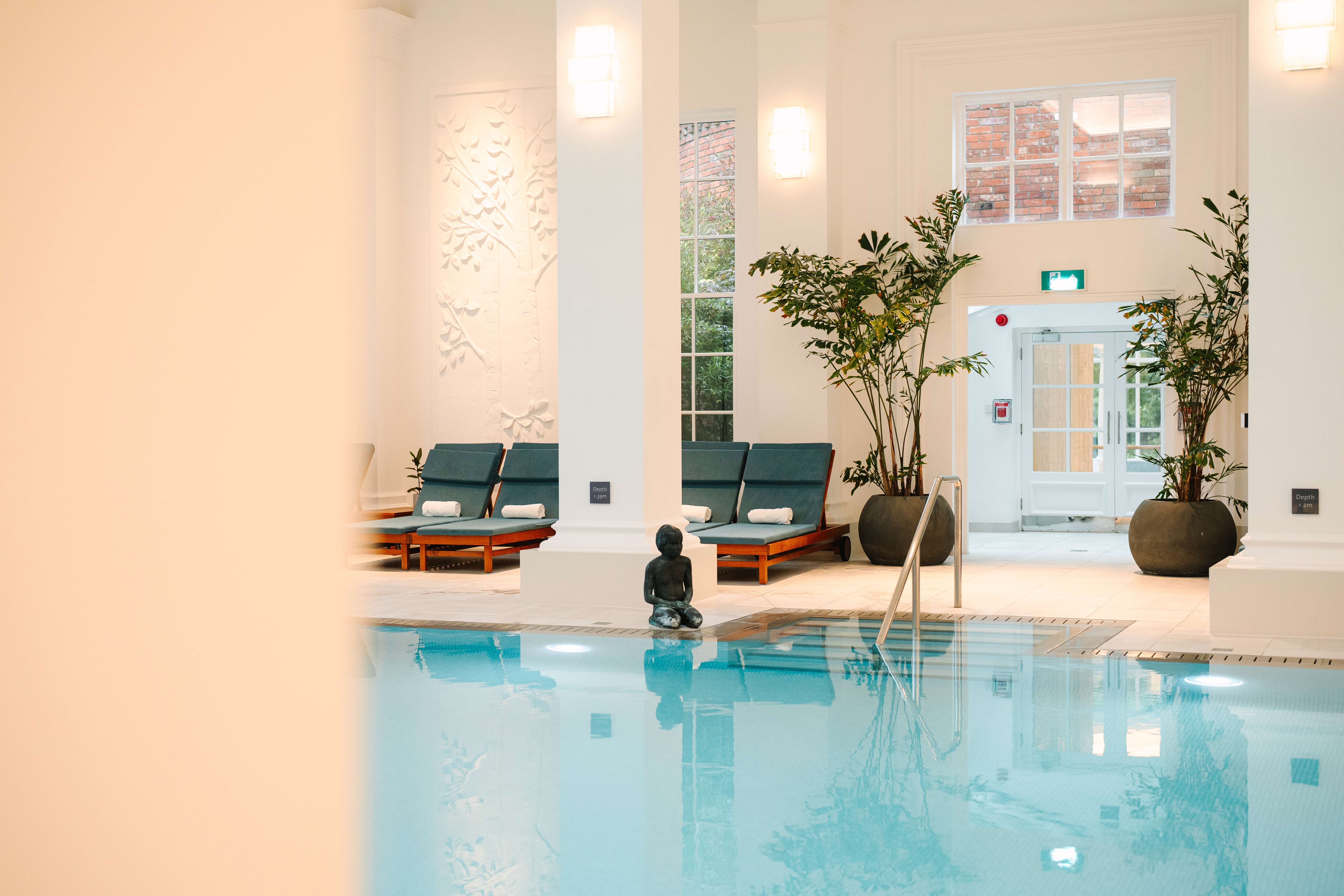 Indoor pool and lounge chairs 